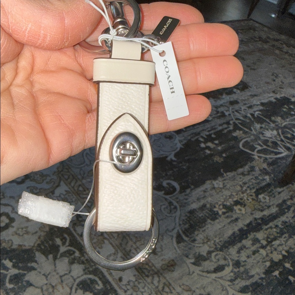 Coach Trigger Lock Chalk Signature Keychain Bag Charm Ivory Leather
